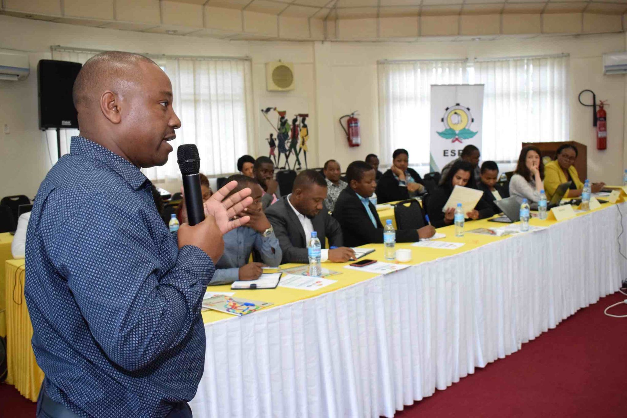 Team member Patrick Kihenzile speaks during the Maize value chain workshop on the 19th June.